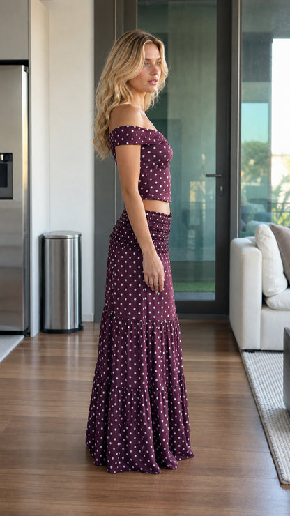 Side profile of model wearing burgundy two piece set