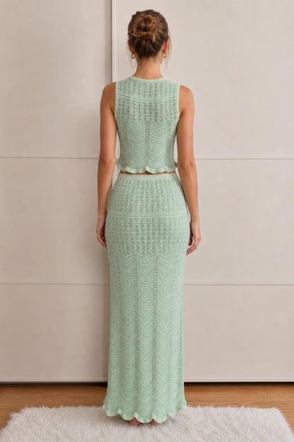 Model wearing mint green knit set, back view