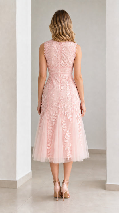 Back view of pink midi dress showing zipper and mesh flare