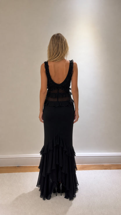 Back view of black maxi dress with scoop back