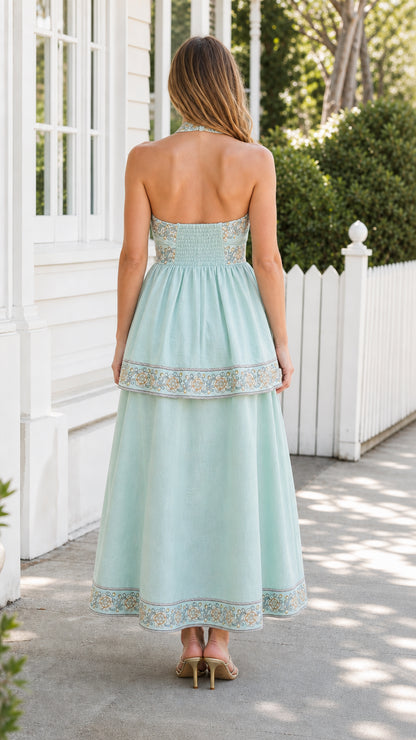 Back view of mint embroidered halter midi dress
