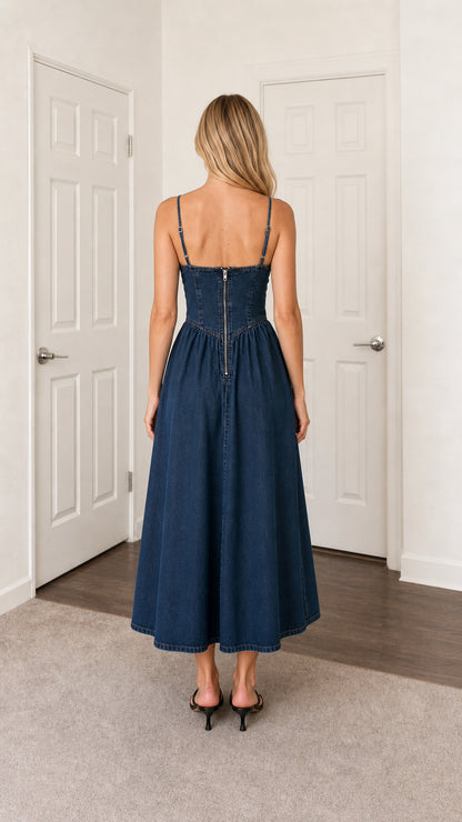 Back view of blue denim midi dress showing zipper