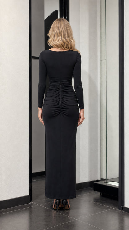 Back view of black maxi dress showing ruching detail