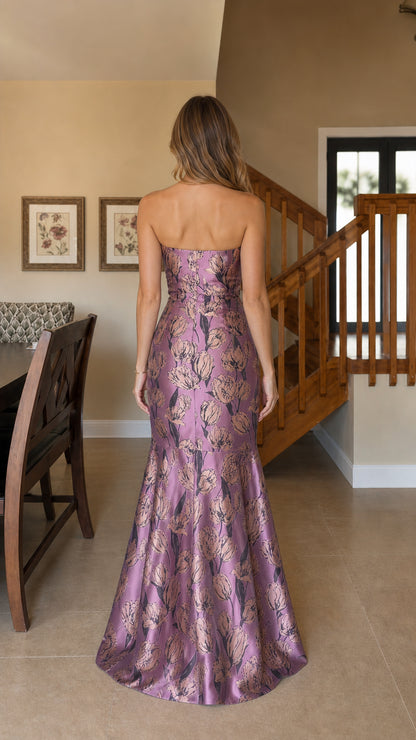 Model wearing purple strapless floral jacquard mermaid evening dress, back view