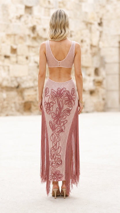 Back view of model in pink fringe dress