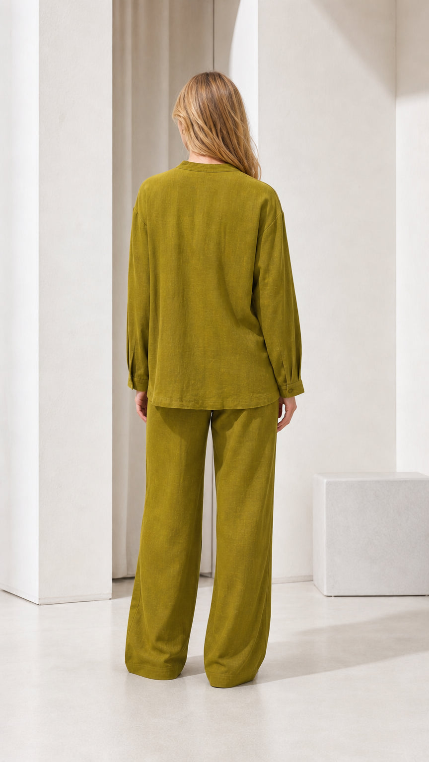 Model wearing olive green linen-blend two-piece set, back view
