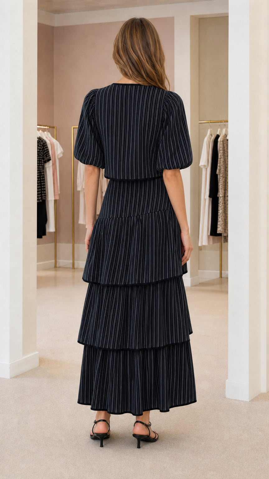 Back view of model wearing black pinstripe matching set