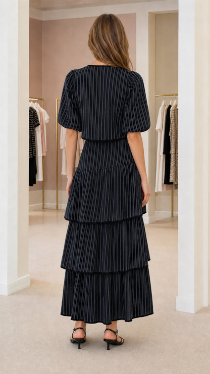 Back view of model wearing black pinstripe matching set