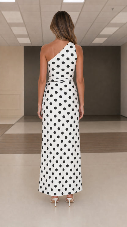 Back view of white polka dot one shoulder maxi dress