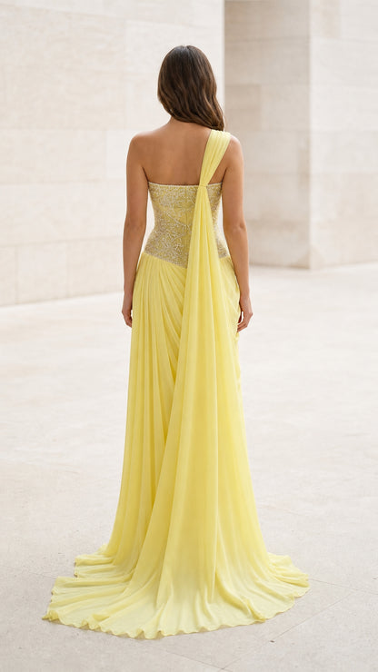 Back view of yellow evening gown with sweeping hem