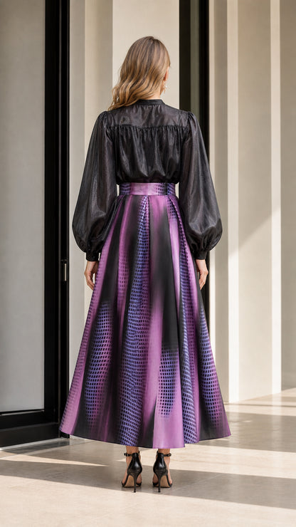 Back view of model wearing black ruffle top and purple gradient skirt