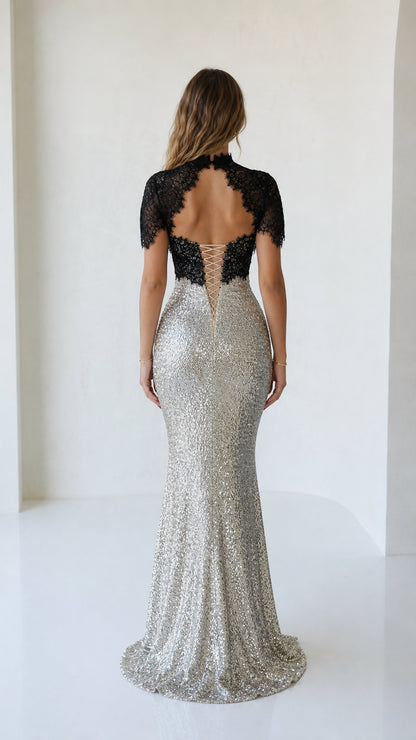 Back view showing lace-up corset detail on silver evening gown
