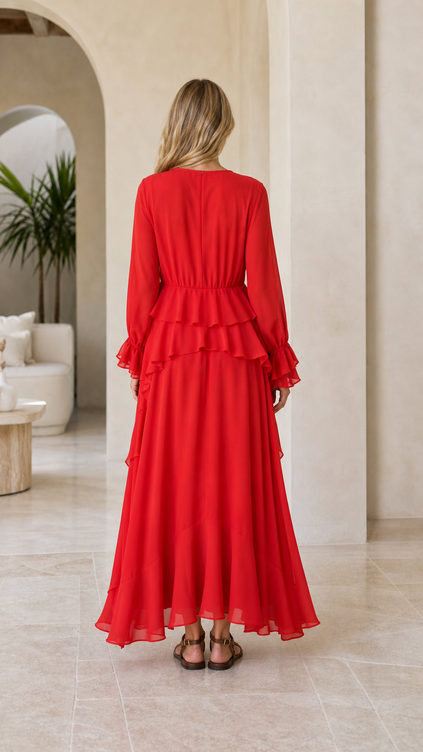 Model wearing red tiered ruffle long sleeve maxi dress back view