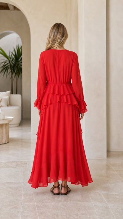 Model wearing red tiered ruffle long sleeve maxi dress back view