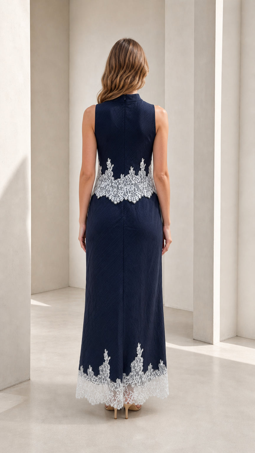 Model wearing navy mock neck lace trim maxi dress, back view