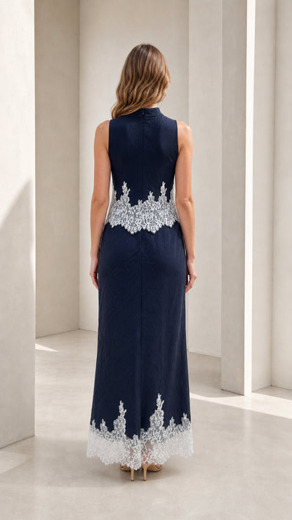 Model wearing navy mock neck lace trim maxi dress, back view