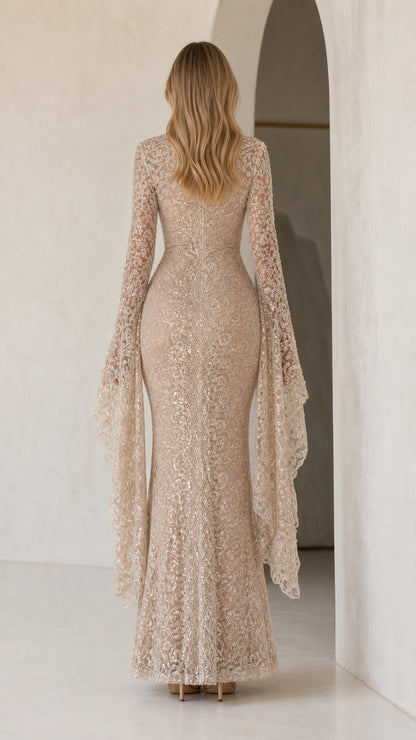 Back view of model in floor-length sequin dress