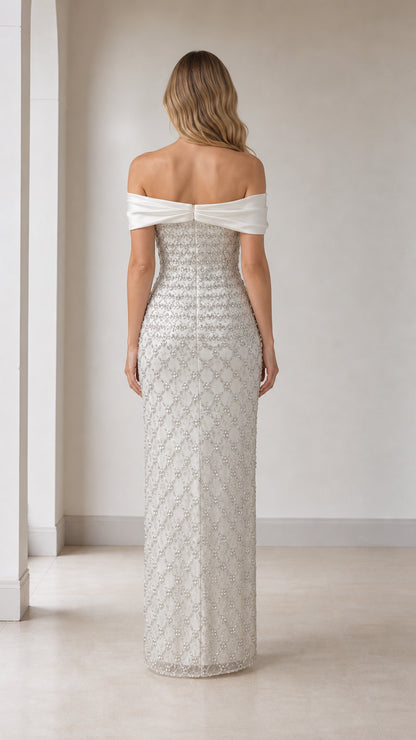 Back view of white off-shoulder beaded evening gown