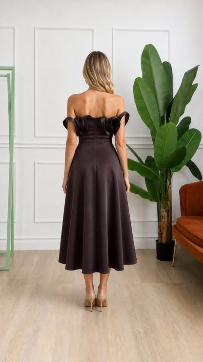 Back view of woman wearing brown midi dress