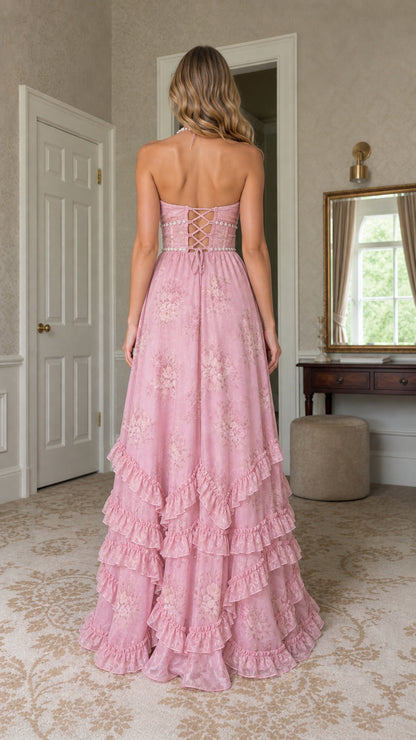 Back view of model showing lace-up corset detail on pink maxi dress