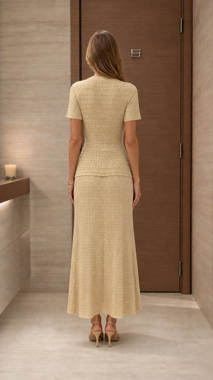 Model wearing beige knit two-piece set from the back