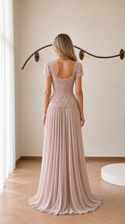 Back view showing scoop back and pleated train of blush pink gown