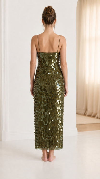 Back view of woman in olive green sequin midi dress