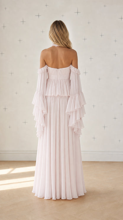 Back view of pink chiffon maxi dress showing pleated draping