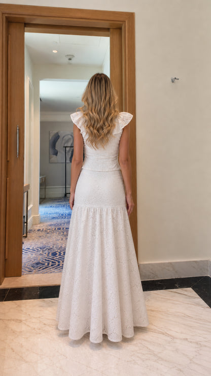 Model wearing white lace two-piece set, back view