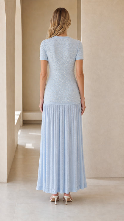 Back view of model in light blue textured knit maxi dress