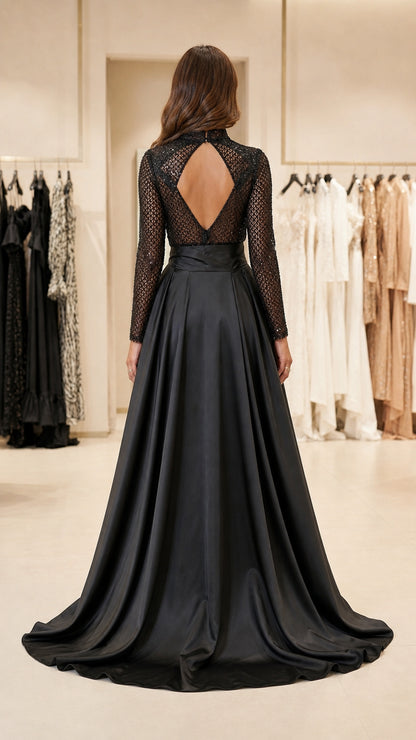 Back view of black jumpsuit highlighting keyhole cutout and overskirt train