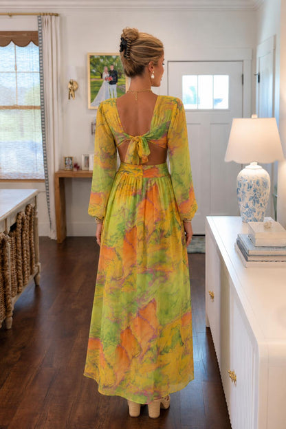 Back view of model showcasing open back and tie detail