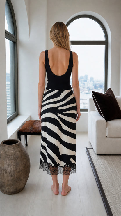 Back view of the black and white zebra print midi skirt with lace-trimmed hem