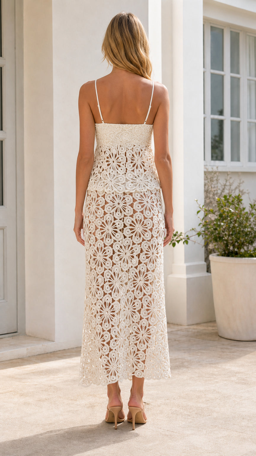 Back view of woman wearing ivory crochet maxi skirt set