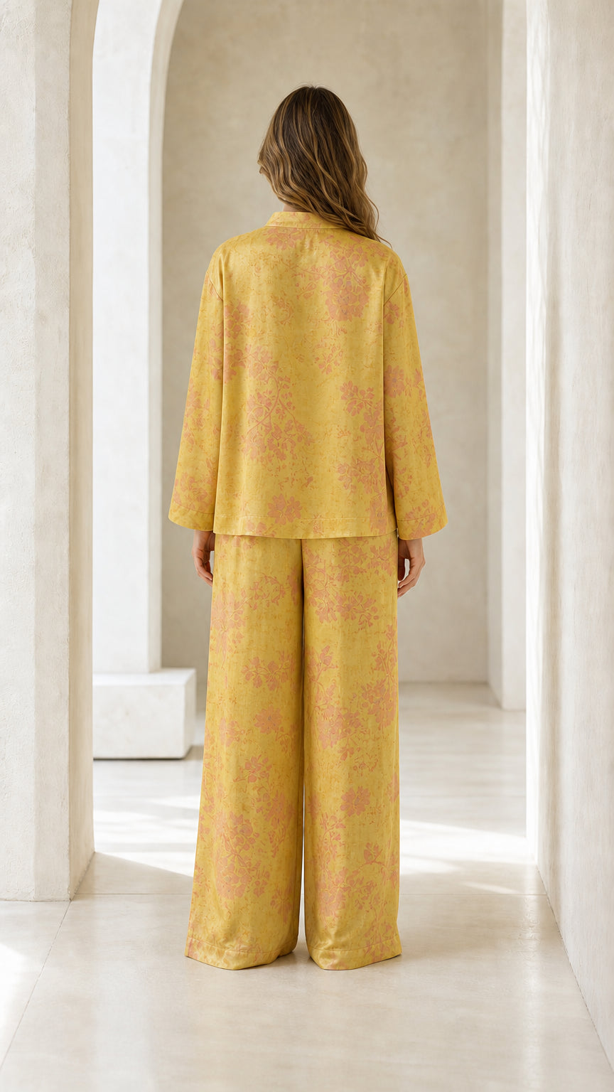Back view of woman wearing yellow floral pants set