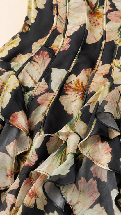 Close-up of fabric and ruffles on Black floral dress