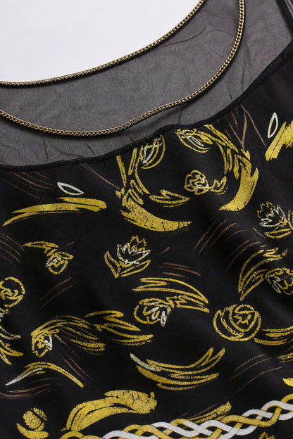 Close-up of sheer neckline with chain trim and gold print detail