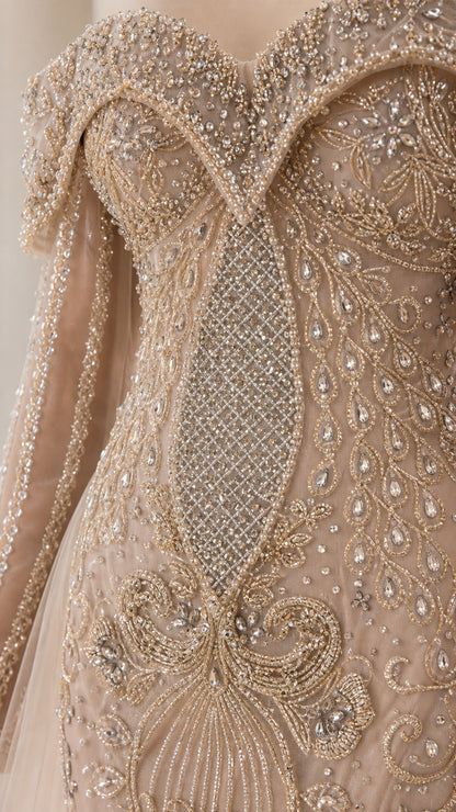 Close-up detail of ornate bodice beading and embroidery