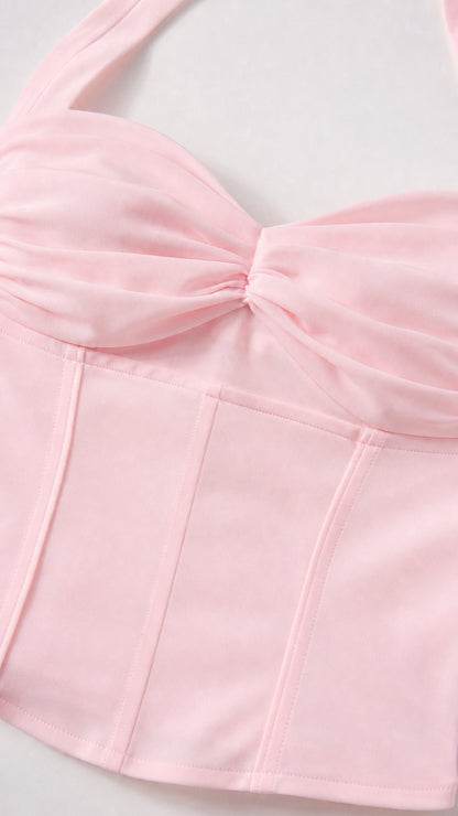 Close up of pink corset top bodice and twist detail