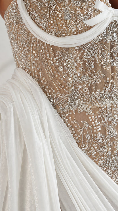 Close-up detail of intricate beadwork, sequins, and embroidery on the bodice