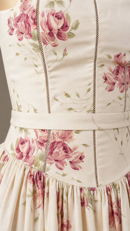Close-up detail of cream floral dress bodice and waist