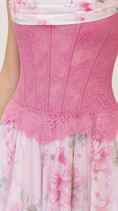 Close up of pink corset bodice and floral skirt detail
