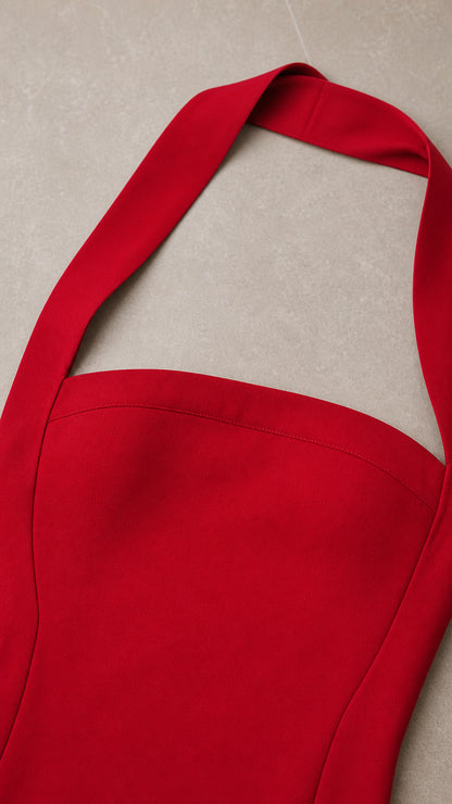 Close up of red halter neck strap and bodice detail