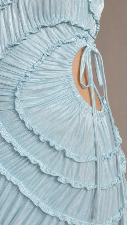 Close-up detail of cascading ruffles and side cut-out tie on light blue dress