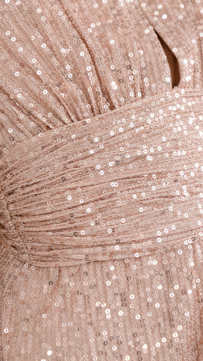 Close-up of champagne sequin fabric and ruched waist