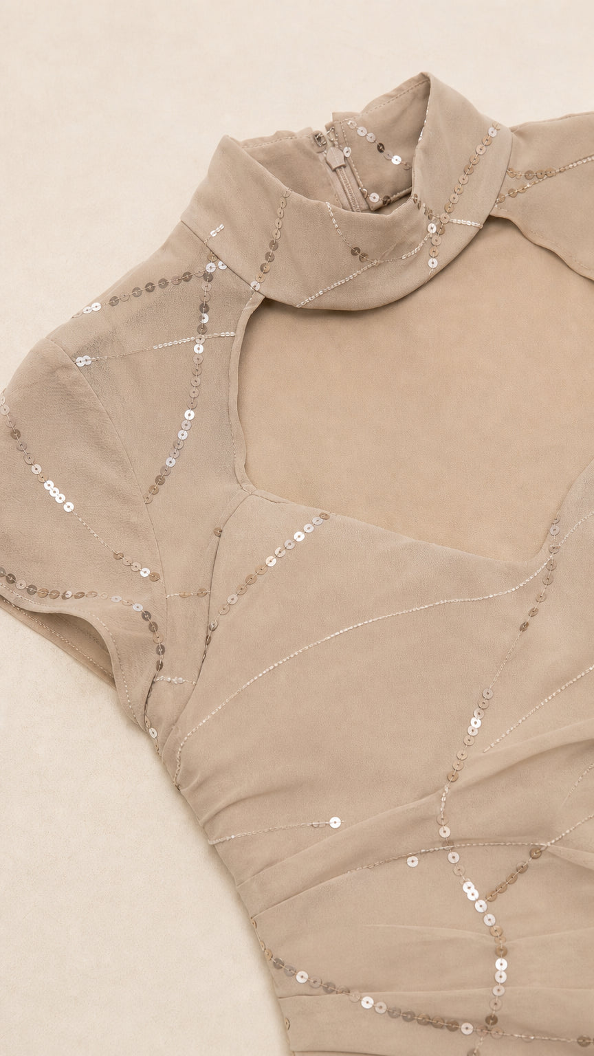 Close-up detail of neckline, choker, and sequin pattern