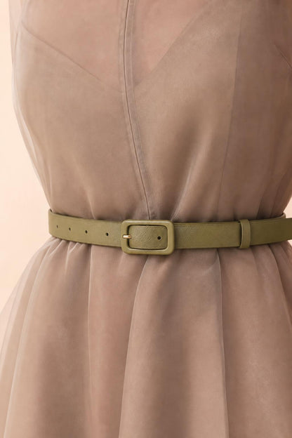 Close-up of organza fabric texture and matching belt detail