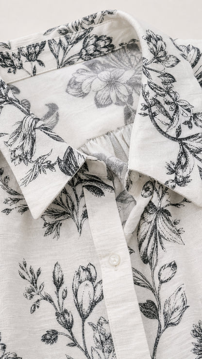 Close-up detail of the collar and floral fabric pattern