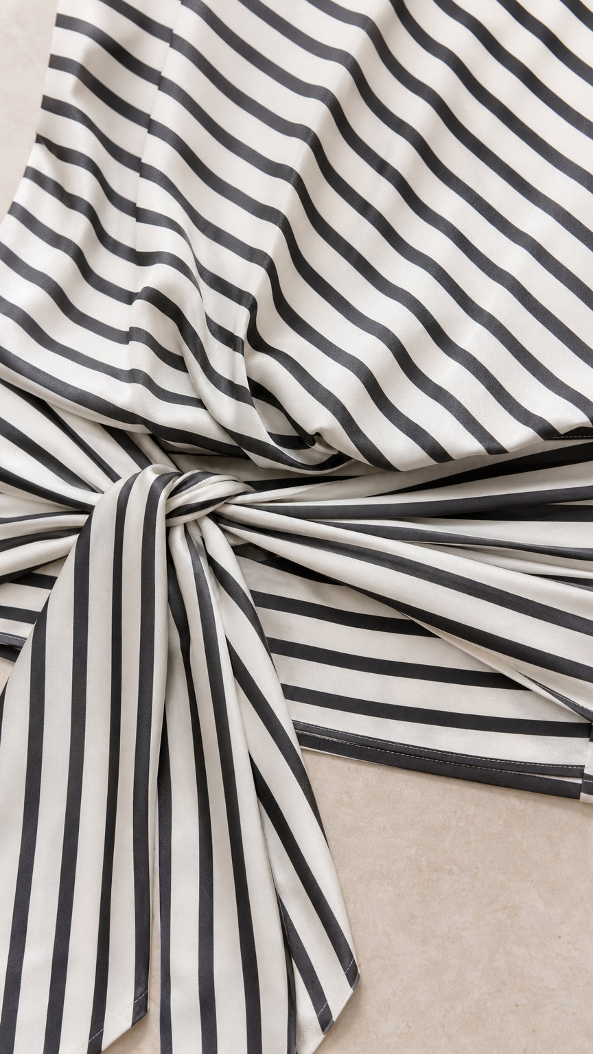 Close-up detail of fabric pattern and side knot tie