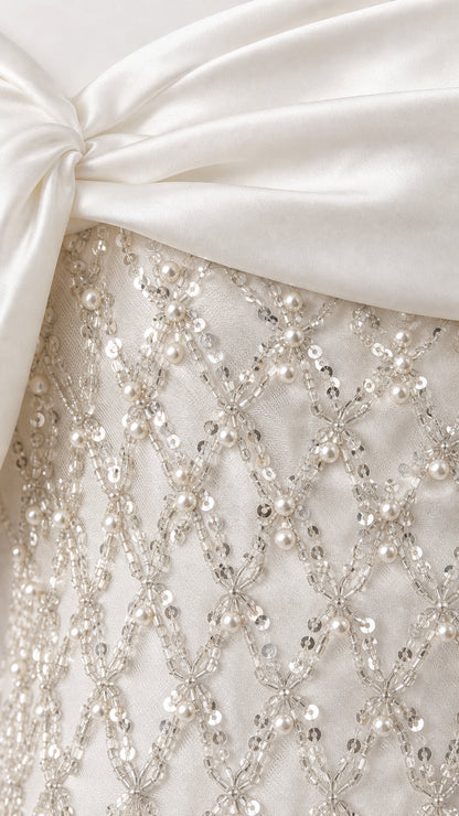 Close-up detail of satin fold and lattice beadwork
